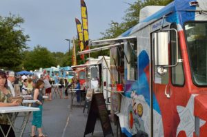 A lineup of parked Food Trucks.